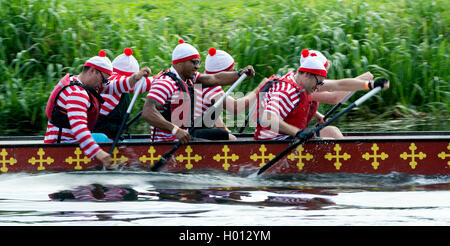 Dragon boat racing, a team in Where`s Wally? fancy dress. Stock Photo